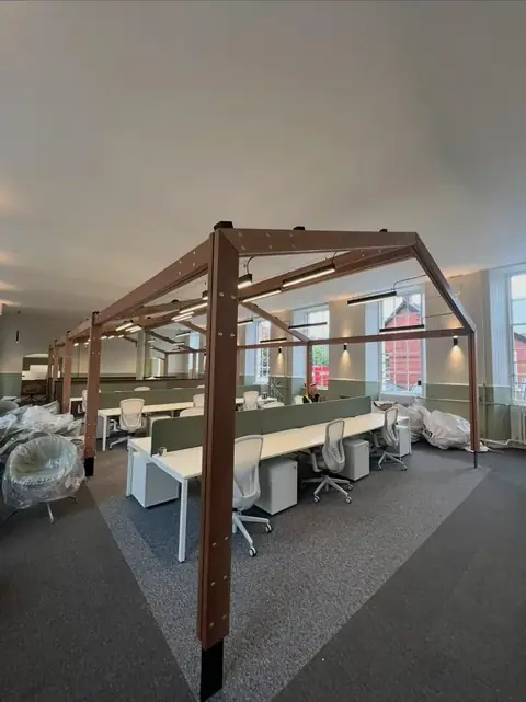 Timber canopy built over an open-plan office