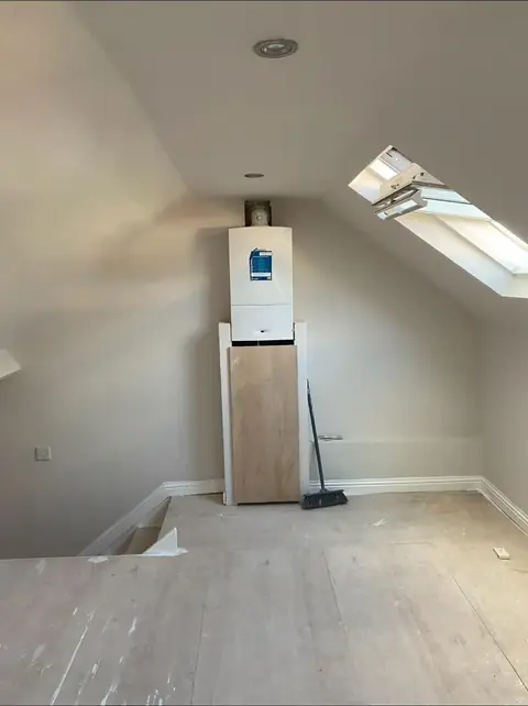 Finished room with the boiler boxed in