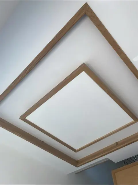 Oak frame set into a plastered ceiling