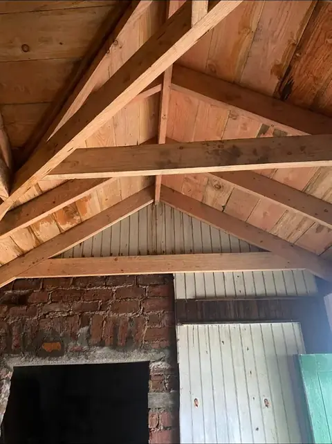 Roof timbers above the old chimney breast